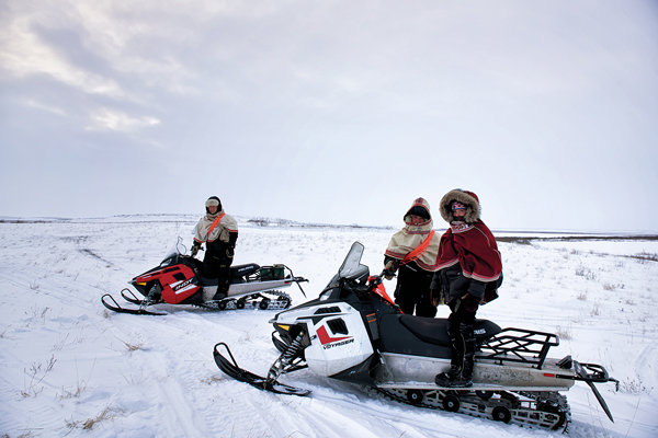 Today's reindeer herders have snowmobiles and SPOT devices at their disposal when bringing the herd from Richards Island, across the Mackenzie River, to Jimmy Lake each winter. Photo courtesy of Jason Van Bruggen/NWTT