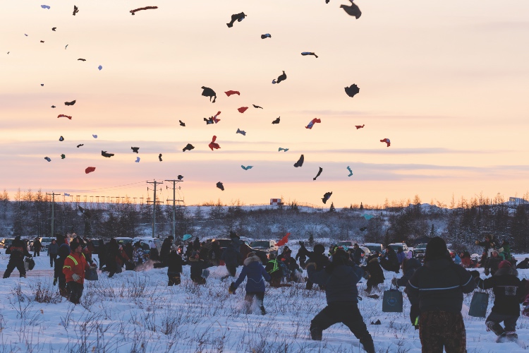 Pilot Johnny May drops candy from an airplane