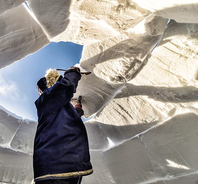 The ingenious iglu:  With snow in abundance, Inuit innovated the domed structures to keep warm and out of the wind in winter. Photo by Paul Aningat