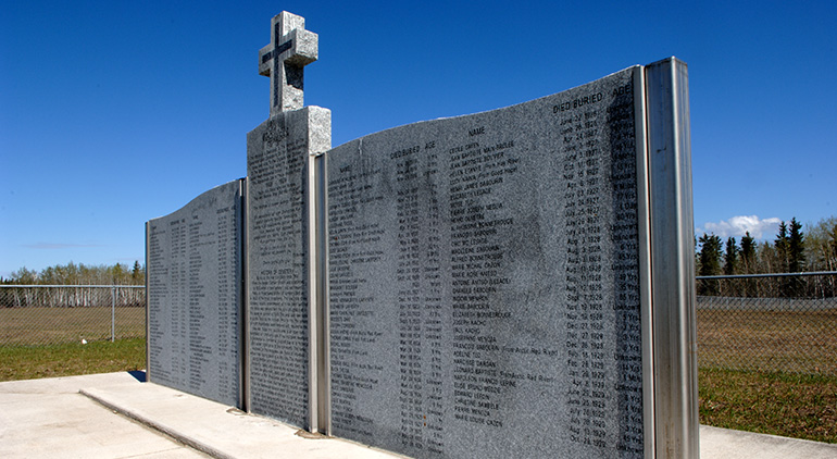 Fort Providence's large rock memorial is engraved with the hundreds of names. Patrick Kane
