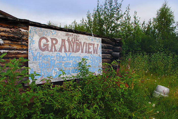 Weeds threaten to overcome Grandview's sign and its promises of greatness