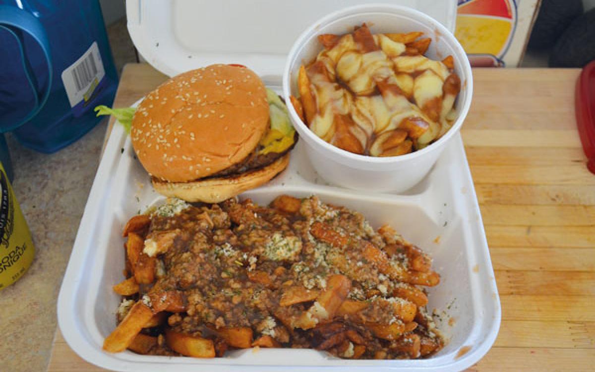 Burger, classic poutine and East Coast-style poutine (French fries topped with Newfoundland dressing--turkey stuffing and gravy) from Iqaluit's Nanook Express food truck. Photo Peter Thuell