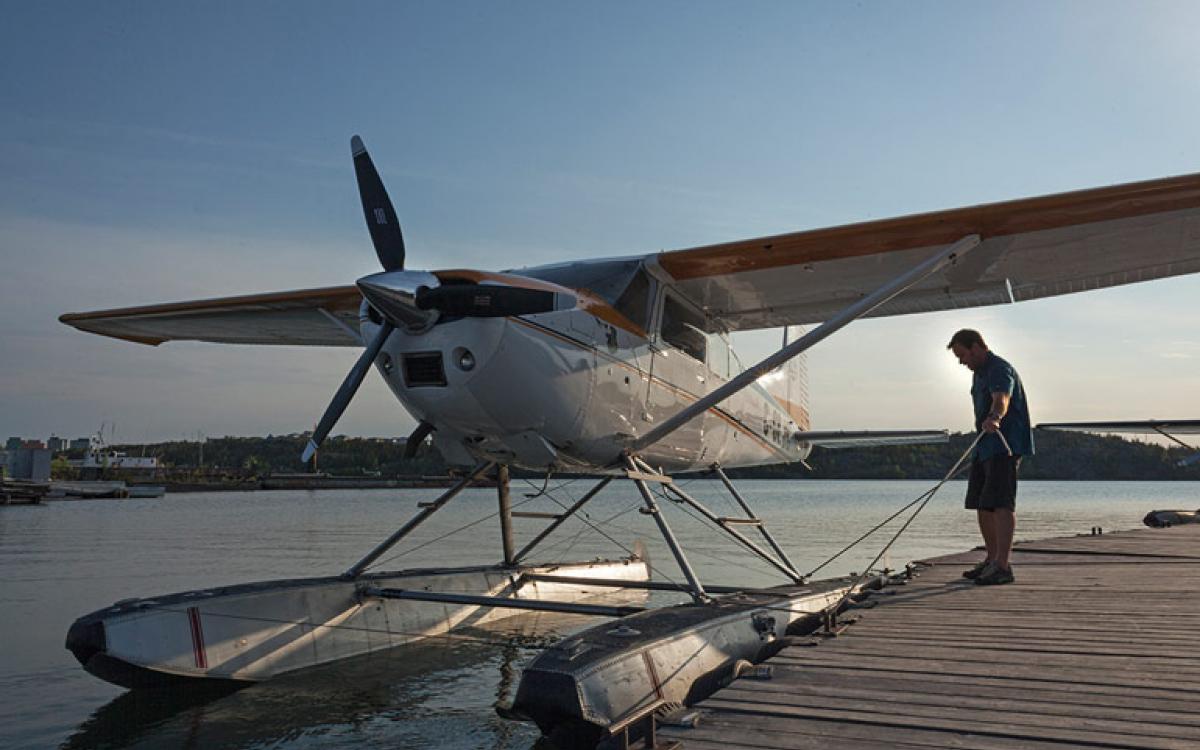 Peter Palme's Cessna 185 is docked steps from the front door of his office. Photo Hannah Eden