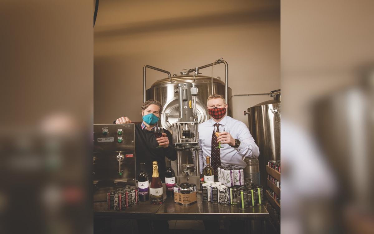Kyle Marchuck (left) and Colin Nickerson raise a toast to the debut of Yukon Wines and Solstice Ciders.