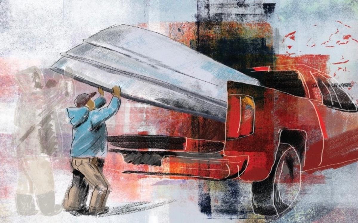 Man getting help with his canoe