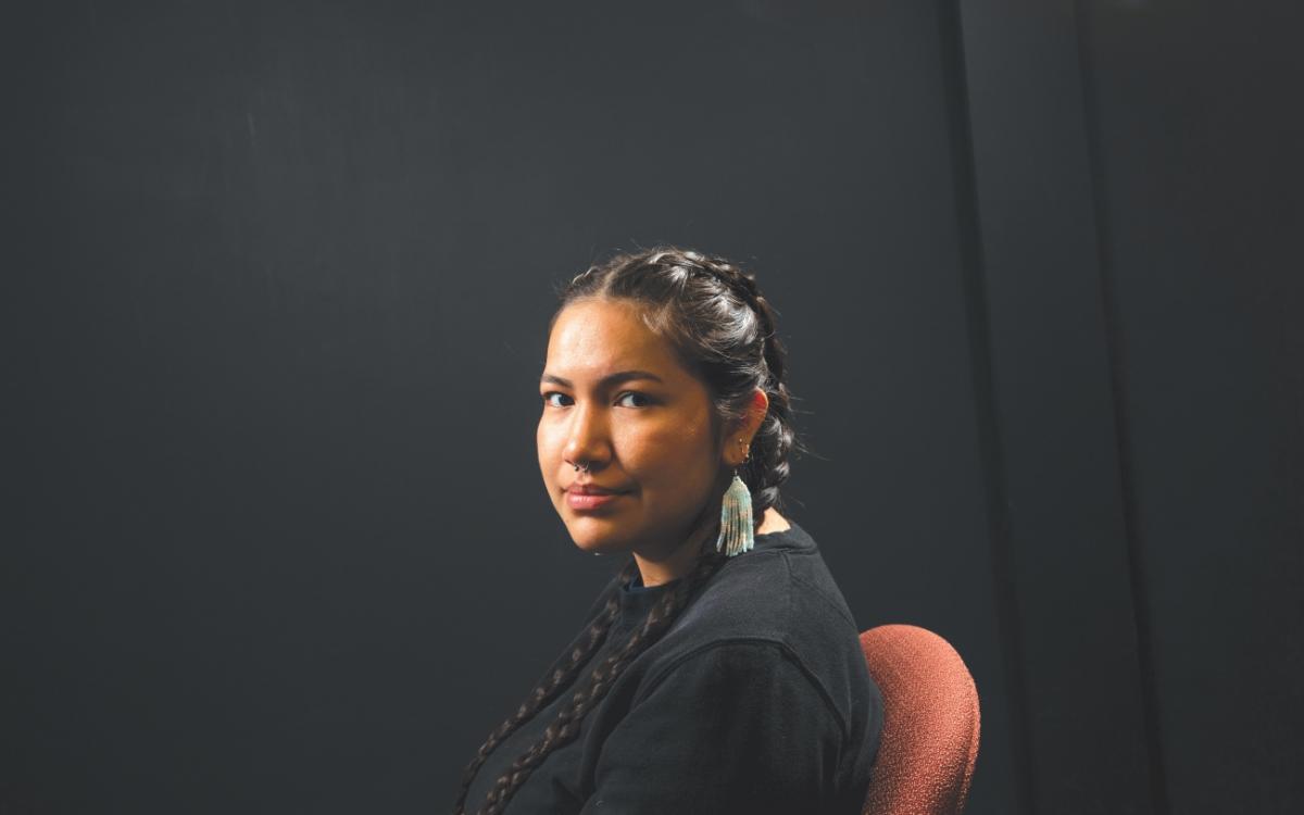 Anonda Canadien shows off her beaded earrings