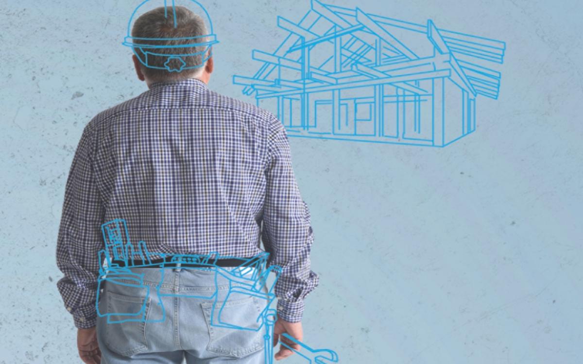 Man looking at blue print houses
