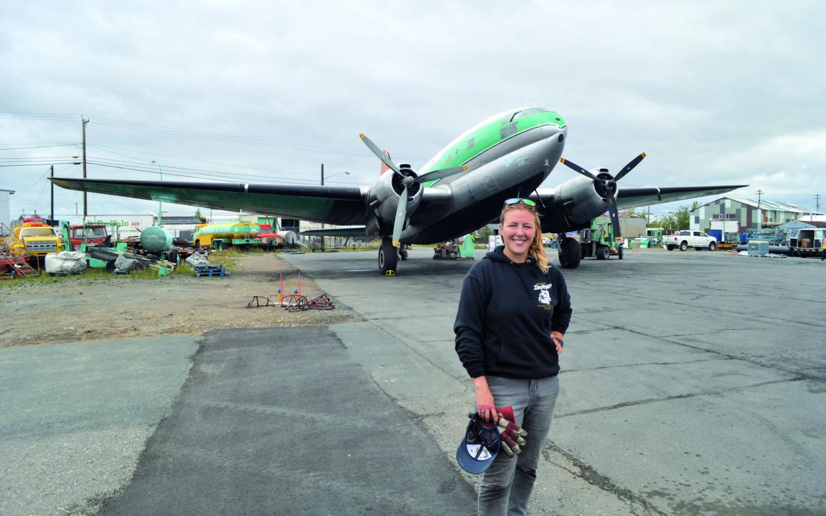 Jamie MacDonald stands in from of a Buffalo plane