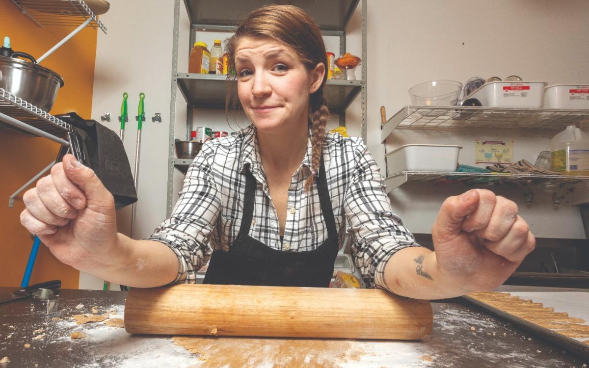 Kaitlyn White-Keyes rolling out dough. 