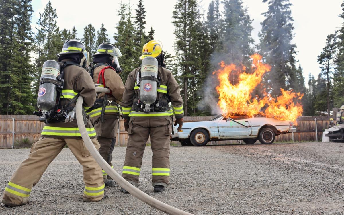Volunteer fire fighters learn the ropes.