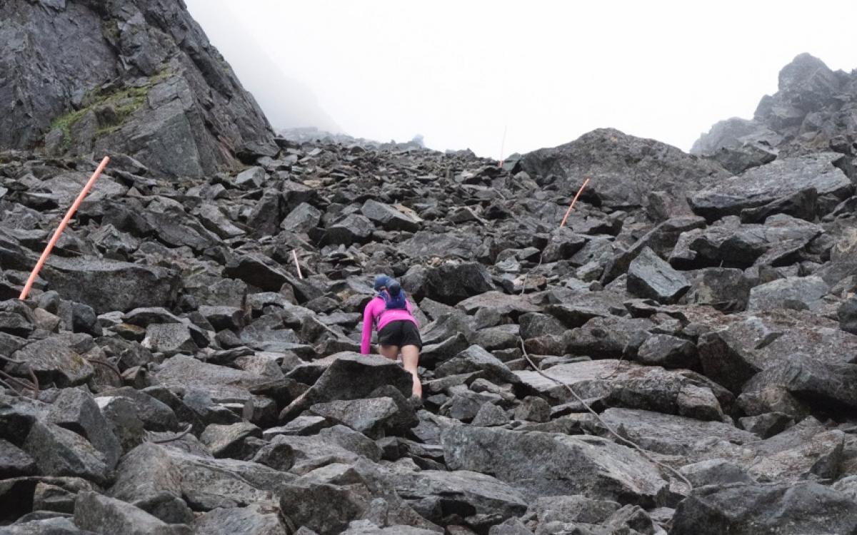 A steep climb up the trail's Golden Stairs, a snow-patched boulder field. 