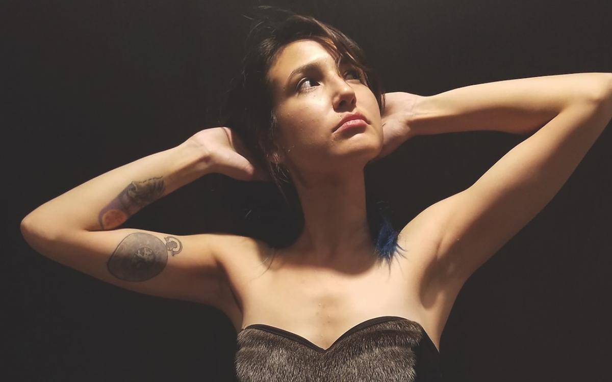 Melissa Attagutsiak models a sealskin corset of her own design. 