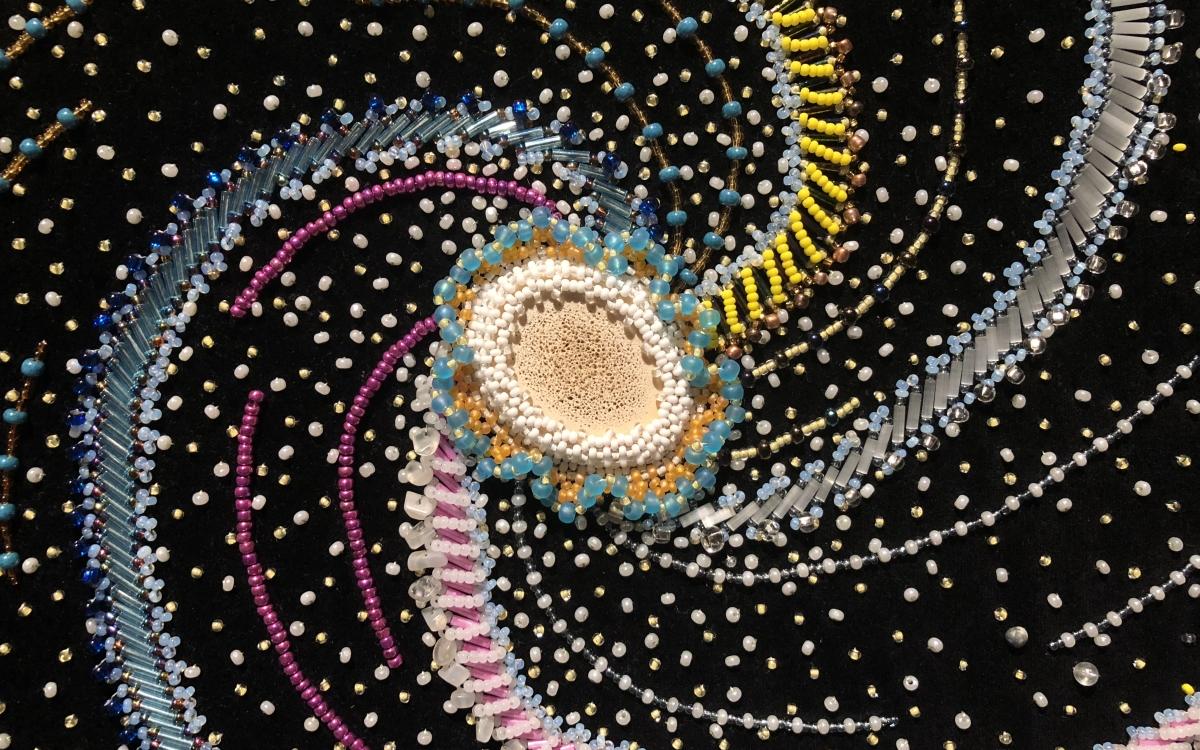 Milky Way Spiral Galaxy (detail) Beadwork on velvet, 23x25.5 in, by Margaret Nazon. 