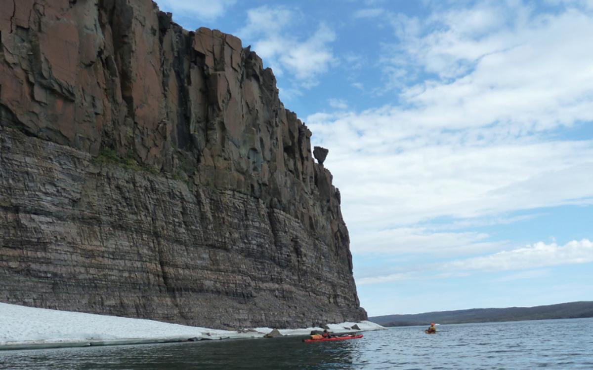 The water levels were likely higher when dinosaurs swam in this sea, as is evidenced by the rock hanging precariously above our travellers. Photos by Eric Binion and Bob Saunders