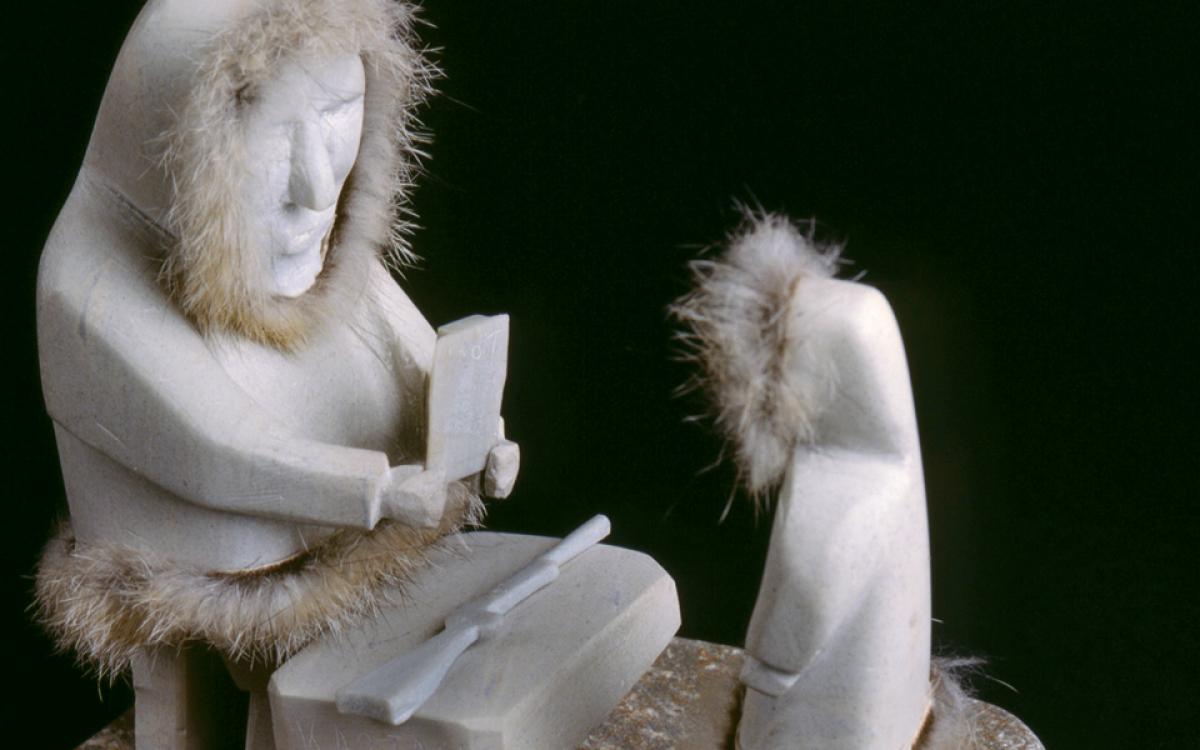 This carving, of Judge J.H. Sissons’ first trial in the NWT, depicts an early interaction between Canada’s legal system and the Inuit. An Inuk, Kaotok, stands before Sissons to answer a charge that he murdered his father on the sea ice. Part of the Sissons/Morrow Collection. © Supreme Court of the Northwest Territories