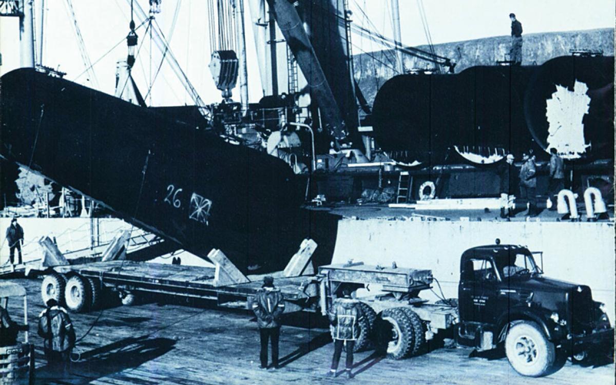 Following a deadly accident involving a bomb-laden B-52, crews at Greenland's Thule Air Base load cylinders of irradiated snow onto a U.S.-bound ship.