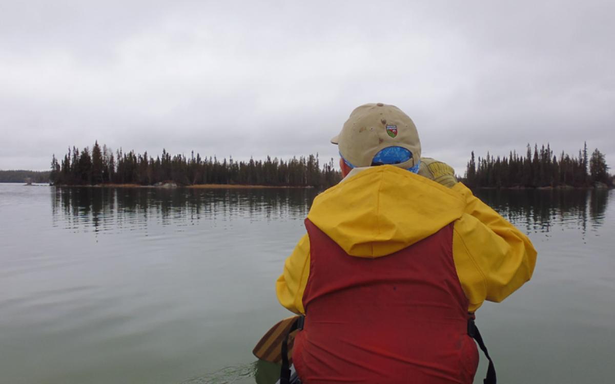 Paddling out to secret weekend camping spots at Hidden Lake, NWT. Photo by Tim Edwards