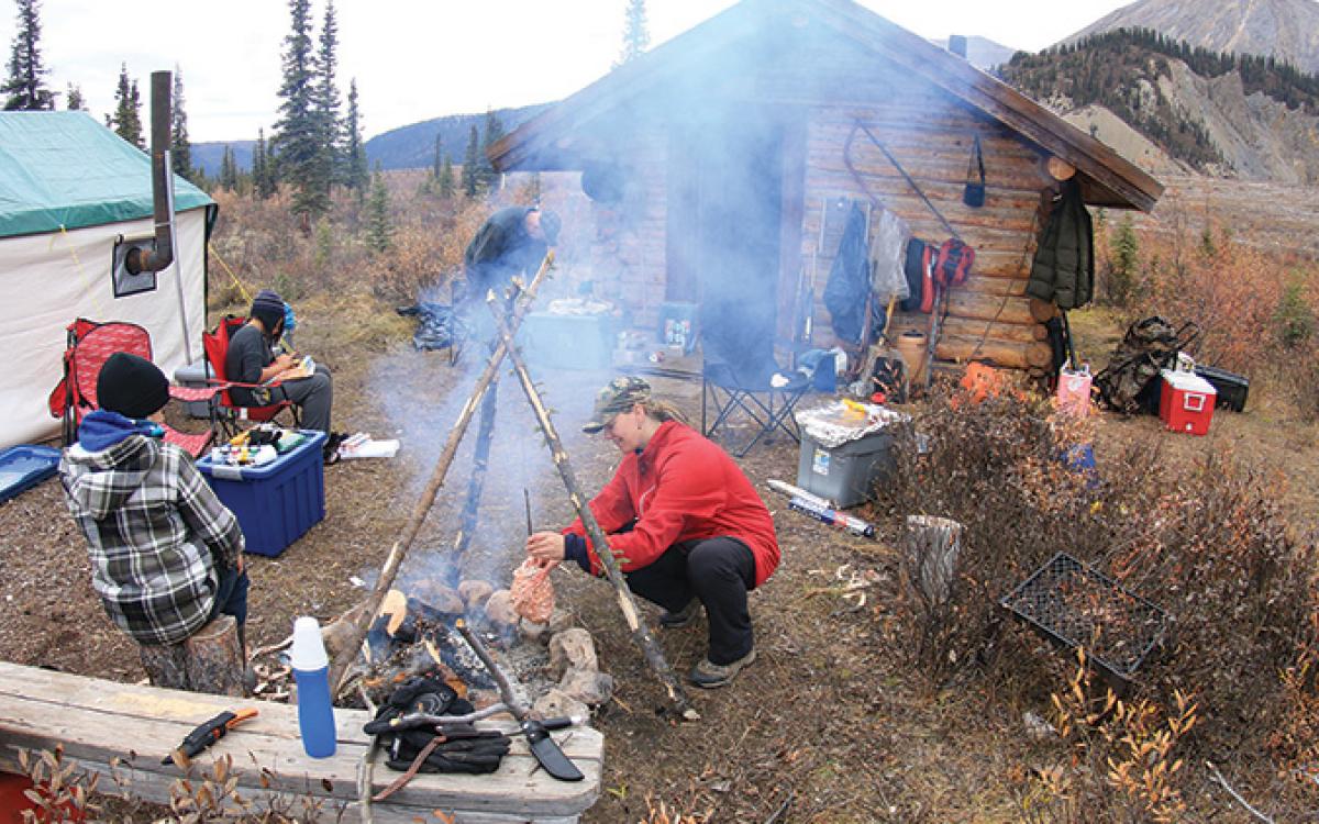 Nichole Richards of Norman Wells, NWT cooking up caribou heart. Photo by Nichole Richards