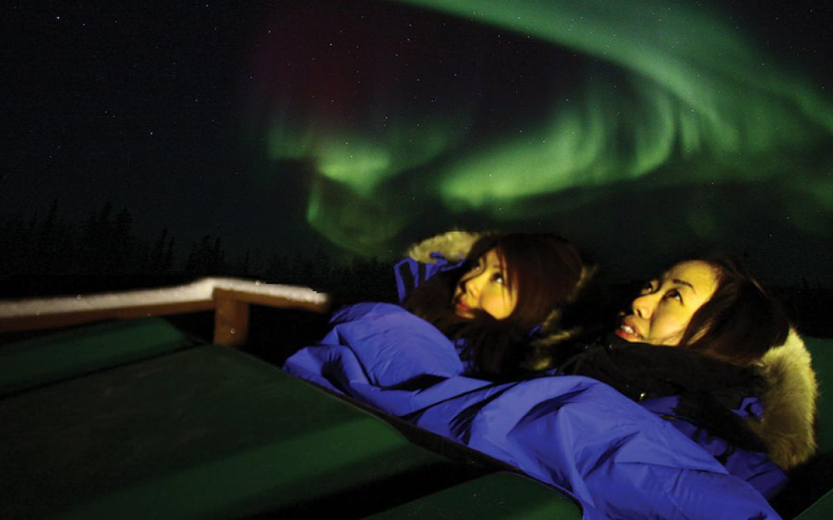 Stay Warm: Tourists view the aurora from a heated pod. Photo courtesy of Aurora Village.