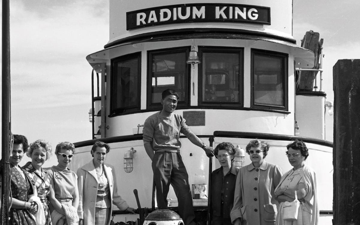 The captain of the Radium King with passengers in Yellowknife in 1954. Credit: NWT Archives, Henry Busse fonds, N-1979-052: 0611