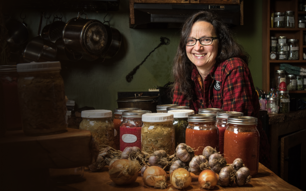 CAN-DO ATTITUDE: Dawson City filmmaker Suzanne Crocker with the fruits—and veggies, and jams, and sauces—of her labour. On July 31, 2017, Crocker began an ambitious project to go one year eating only what could be found or foraged around the Yukon town. 
