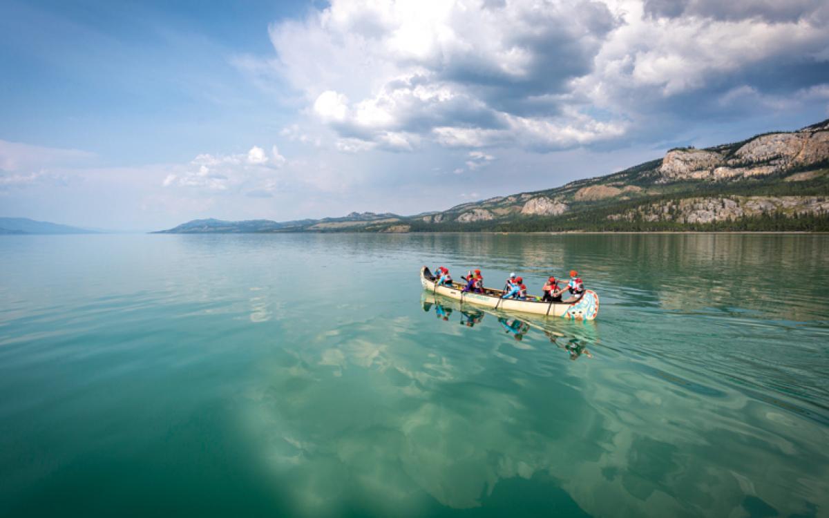 Paddlers cross Lake Laberge during the 2015 Yukon River Quest. Photo by Joel Krahn