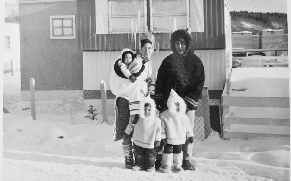 The Tootoos' 1965 Christmas portrait, with baby Victor in the author's amauti, Jennifer, the oldest, in front of her father, and in the middle, a restless Hunter. Photo Courtesy Sally Luttmer