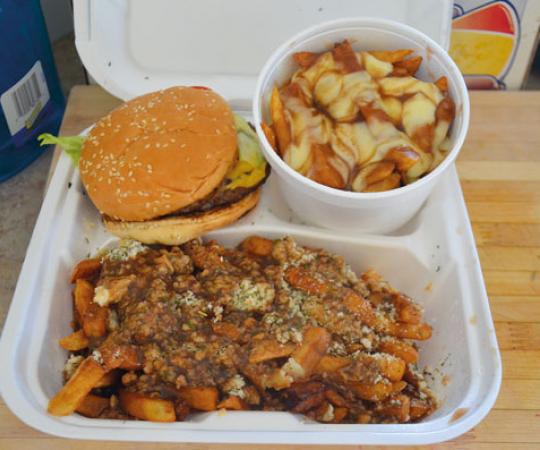 Burger, classic poutine and East Coast-style poutine (French fries topped with Newfoundland dressing--turkey stuffing and gravy) from Iqaluit's Nanook Express food truck. Photo Peter Thuell