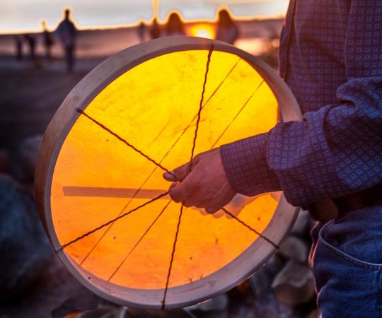 Dene man with drum.