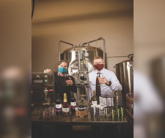 Kyle Marchuck (left) and Colin Nickerson raise a toast to the debut of Yukon Wines and Solstice Ciders.