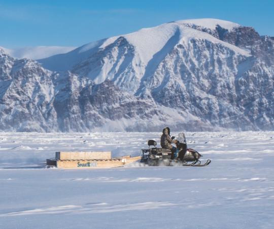 SmartICE team pulling a sensor across the ice