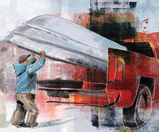 Man getting help with his canoe