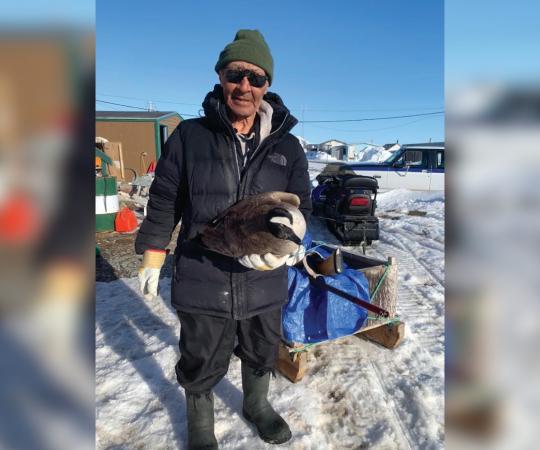 Joe Kitekudlak shows off a goose.