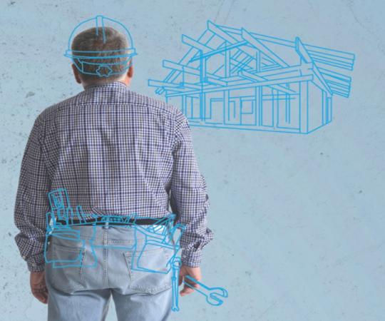 Man looking at blue print houses