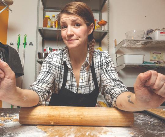 Kaitlyn White-Keyes rolling out dough. 