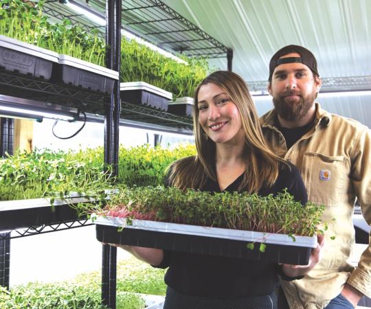 Chris Shaver and Nicolinea Minakis post with micro greens