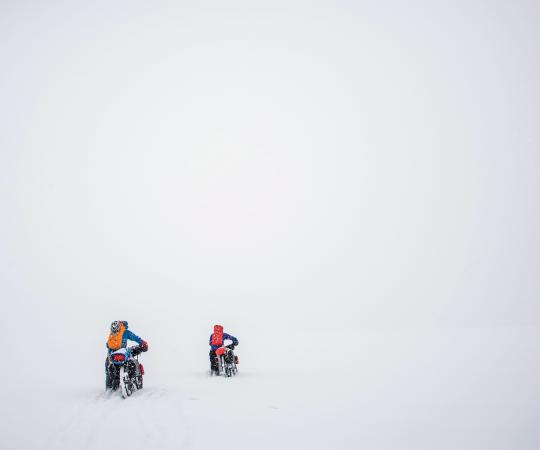 Karl Medig, Carl Moriarty, and Alex Frankel cycle through Auyuittuq National Park in Nunavut. 