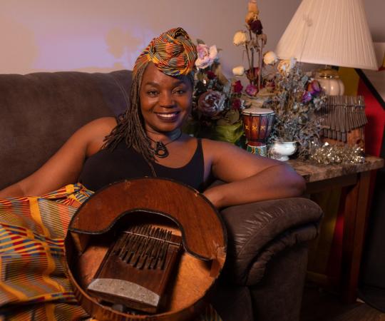 Francisca Mandeya holds a mbira.