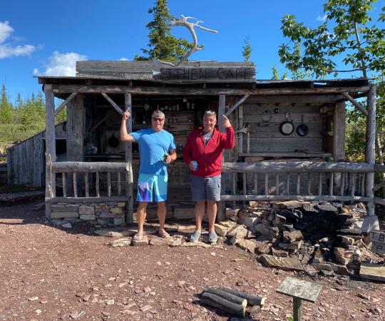Wally Lemay and Frank Dwyer in front of Etthen Café on Great Slave Lake