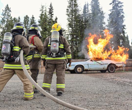 Volunteer fire fighters learn the ropes.
