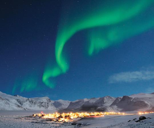 The aurora shimmer over Pangnirtung, Nunavut in winter. www.michaelhdavies.com