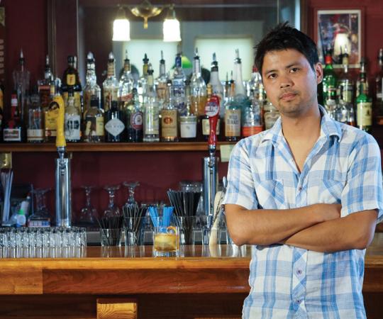 Ryan Matthew pours the drinks. Next time you see him, you might be seeing double. Photo by Chris Healy