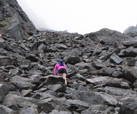 A steep climb up the trail's Golden Stairs, a snow-patched boulder field. 