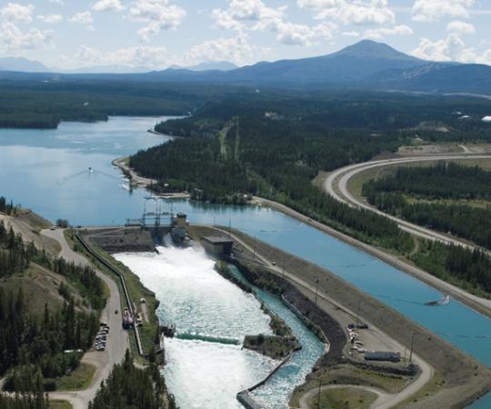 The Whitehorse Dam. Its construction drowned the capital's namesake White Horse Rapids, which now lie beneath Lake Schwatka. Photo courtesy Archbould Photography/Yukon Energy