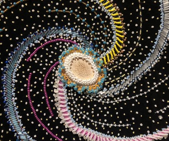 Milky Way Spiral Galaxy (detail) Beadwork on velvet, 23x25.5 in, by Margaret Nazon. 