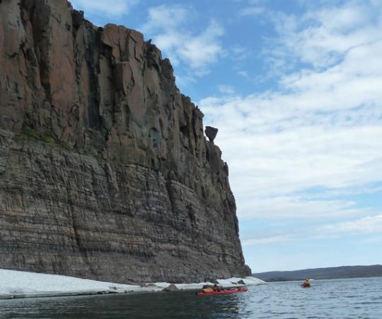 The water levels were likely higher when dinosaurs swam in this sea, as is evidenced by the rock hanging precariously above our travellers. Photos by Eric Binion and Bob Saunders