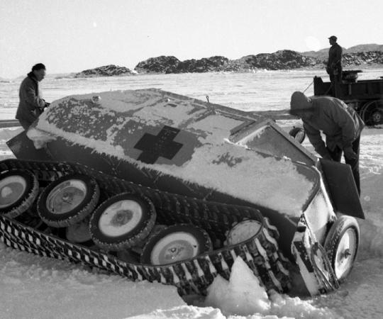 An "Penguin" snowmobile/tank falls through the ice. NWT Archives/Henry Busse/N-1979-052-2141