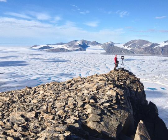 Glaciologist Adrienne White looks out at the Milne Ice Shelf. 