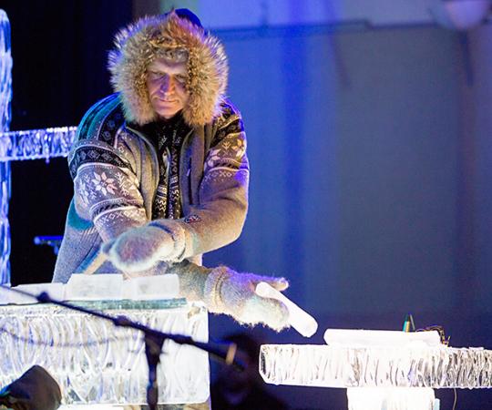 Terje Isungset tests the ice by drumming it with his fingers. 