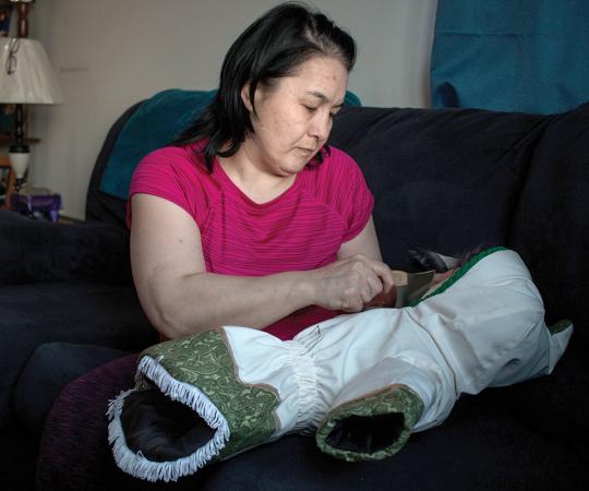 Corinne Pilakapsi makes her parkas at her home in Rankin Inlet. 
